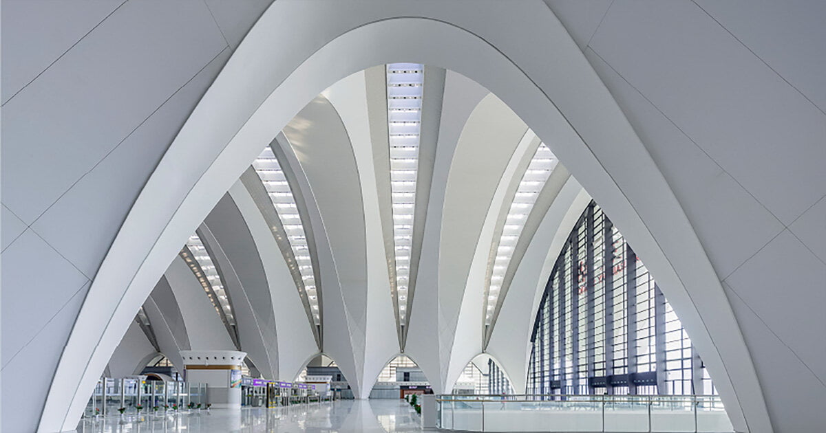 white steel arch trusses form nanchang east station's roof wings