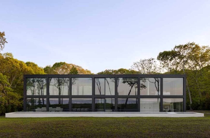 A Grid Of Large Windows Maximizes The Water Views At This Modern Home