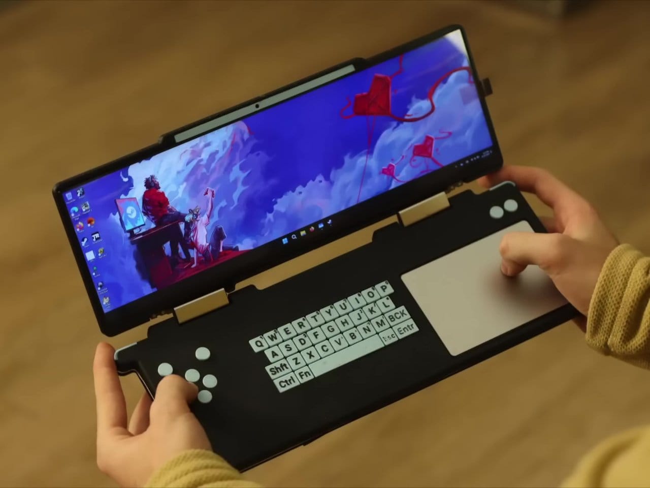 تقوم شركة Steam Deck DS الهجينة ذات النطاق الواسع جدًا بتداول عصا التحكم للوحة المفاتيح ولوحة التتبع