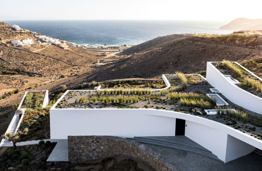 curved dry stone wall outlines mykonian villa by A31 and tom dixon