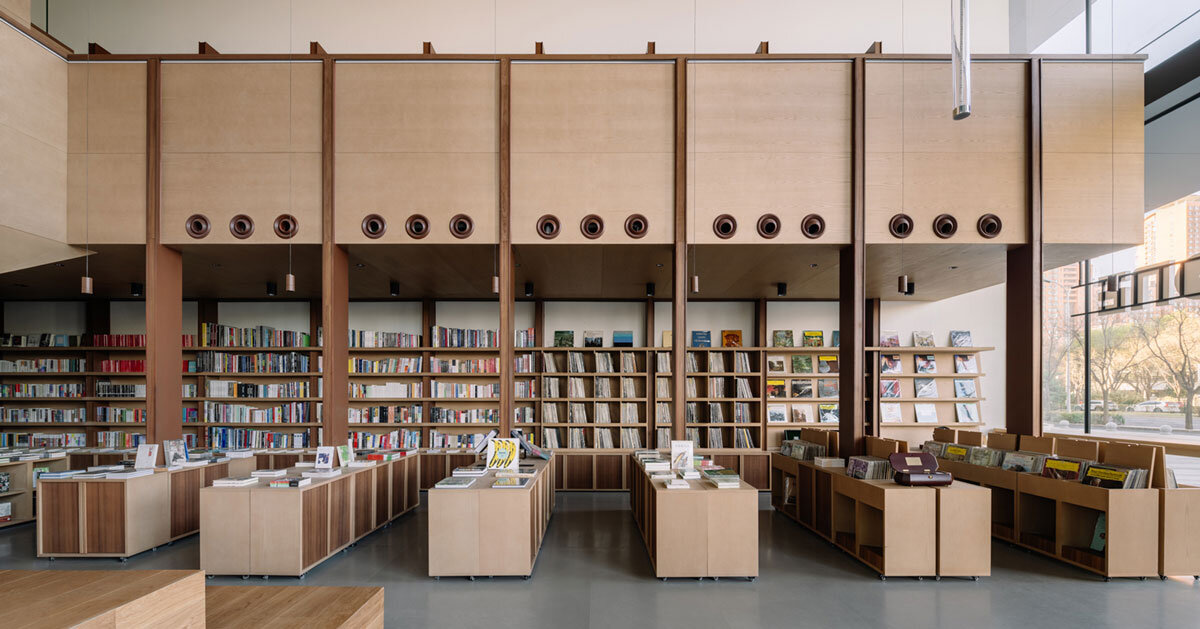 lllab. clads pageone vinyl concept bookstore's interiors with wood in beijing