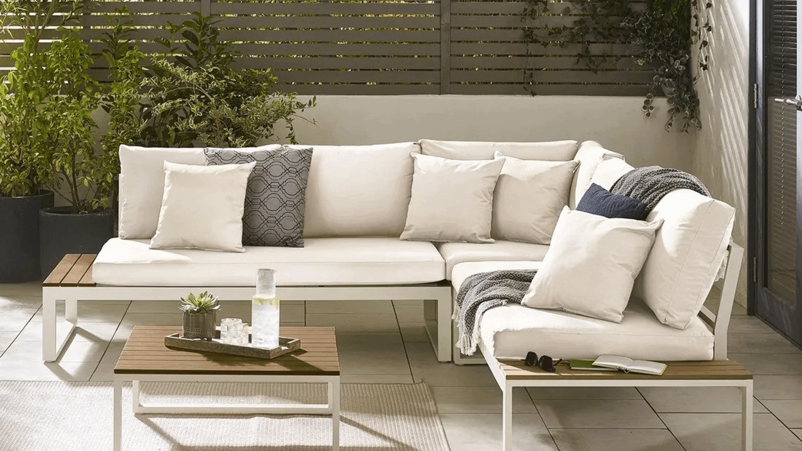 White corner sofa in a garden