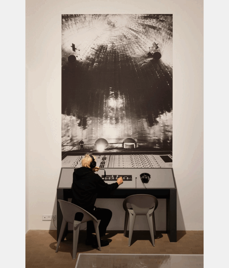 person seated at exhibition display