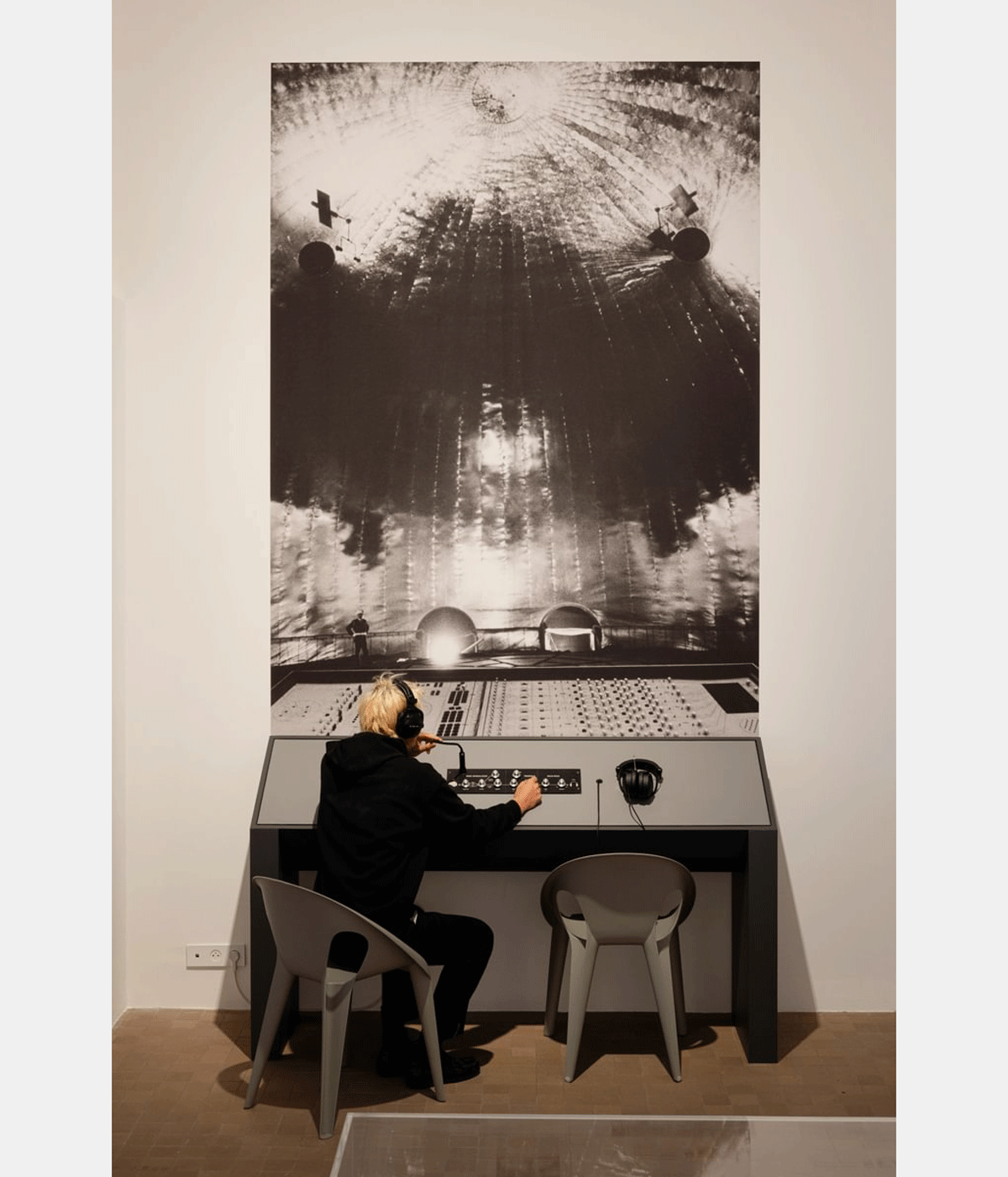 person seated at exhibition display