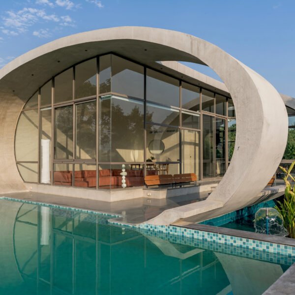 The house overlooks a pool