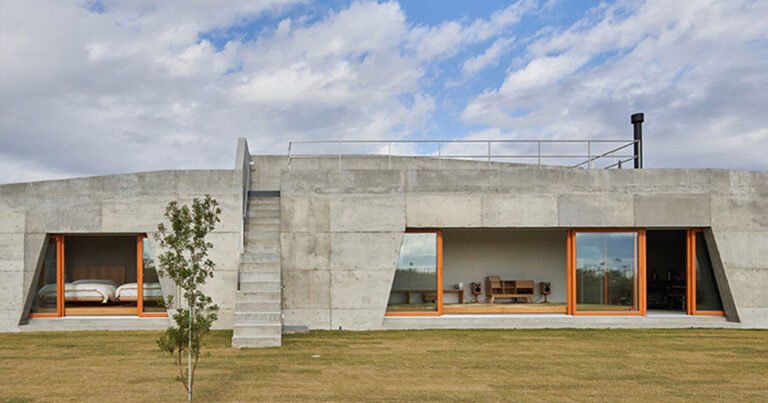 concrete isumi villa by takeshi hosaka architects spreads over land in japan