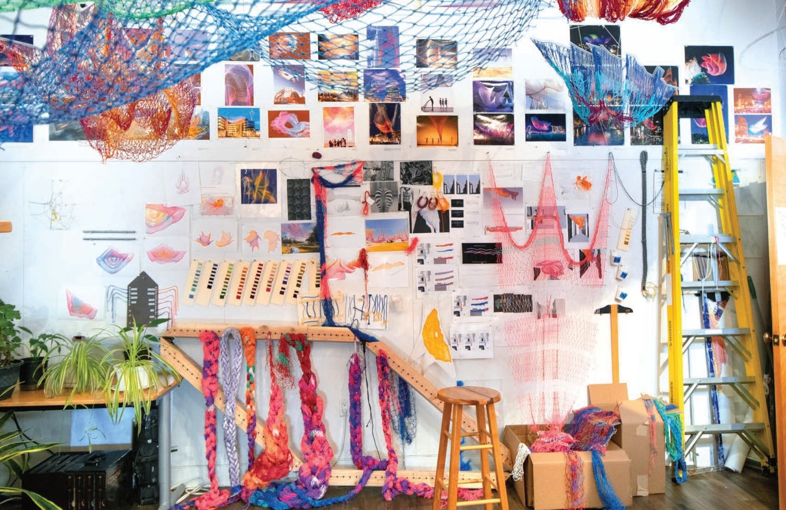 an open book spread showing a studio from 'Radical Softness: The Responsive Art of Janet Echelman'