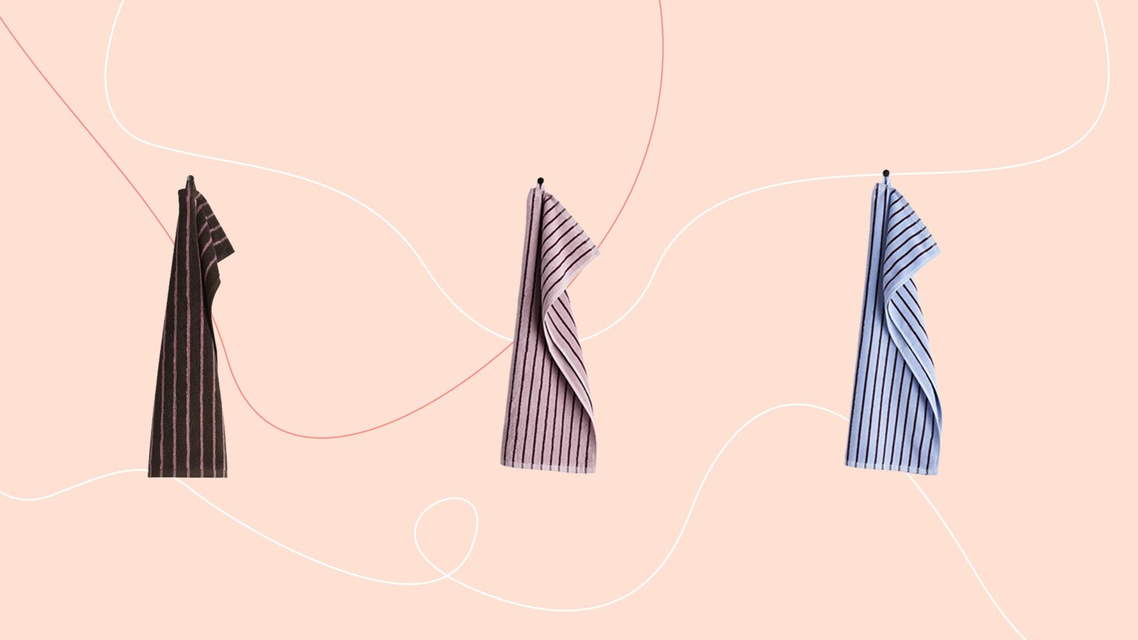 Striped towels on pink background
