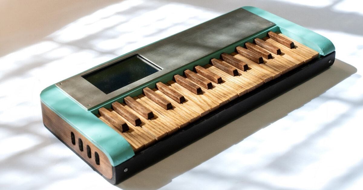 cardboard synthesizer makes sounds with handmade wooden keys