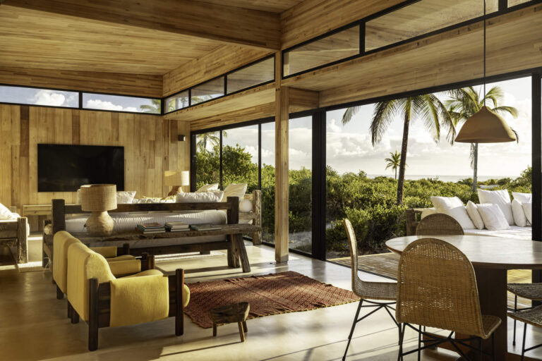 A Modular Home Designed for Life Between the River and the Sea 7 A modular home set between the river and the sea, designed for calm tropical living. Warm wood interiors, large glass openings, and open patios create a seamless flow between forest, coast, and indoor comfort.