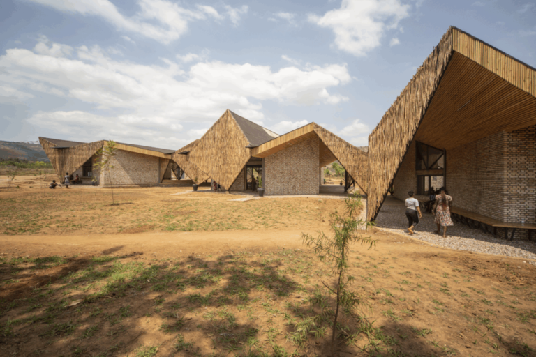 Community center exterior with brick walls and woven eucalyptus screens