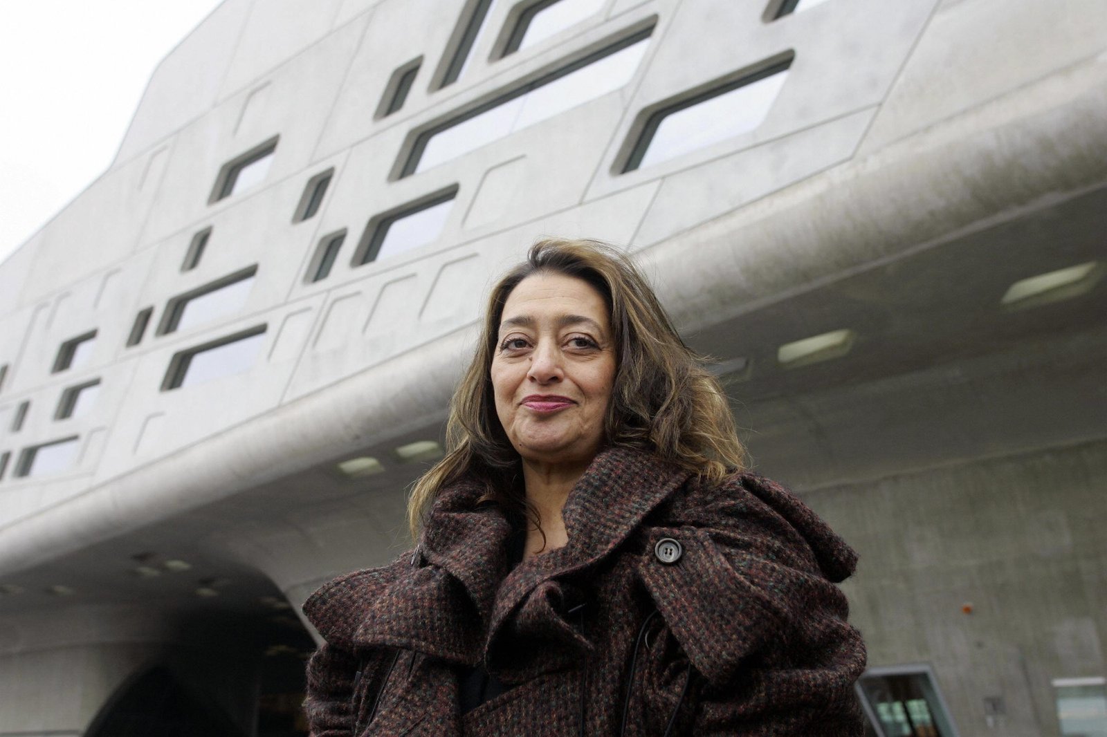 architect Zaha Hadid standing in front of a building