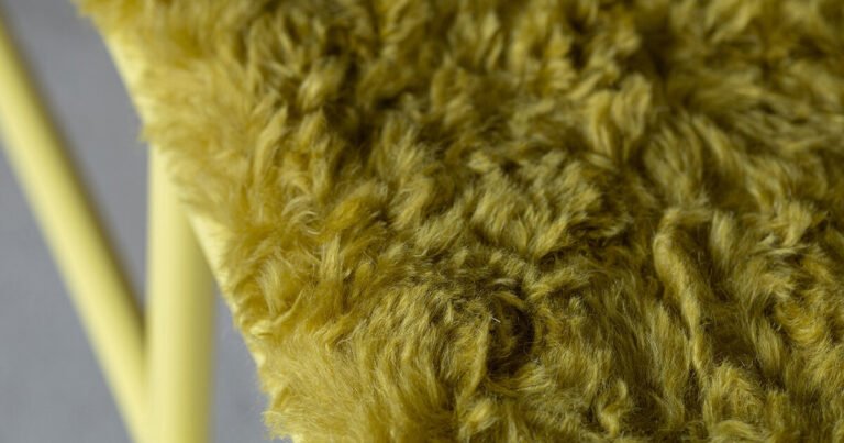 plush long-pile textile wraps tubular yellow steel bench