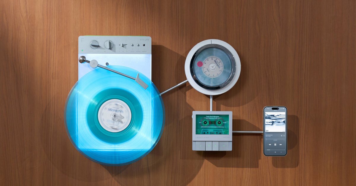 wall-mounted vinyl player connects with CD and cassette decks for triple listening session