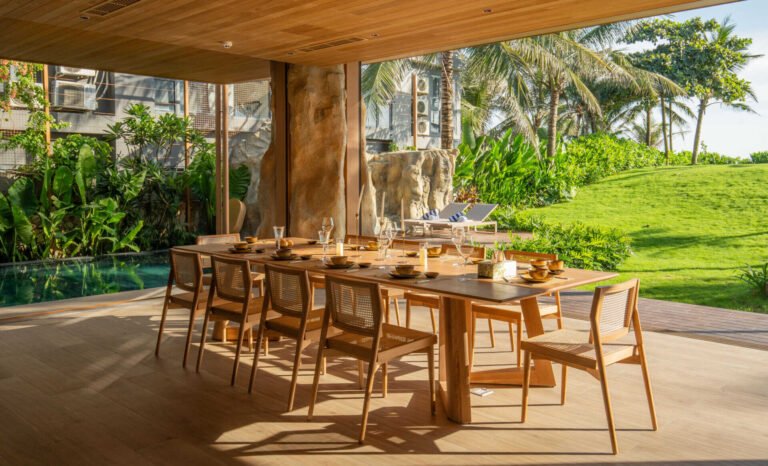 A Seaside Villa in Vietnam With a Roof Inspired by Flying Seabirds 17 A light-filled dining area sits within the villa