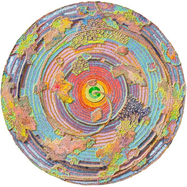 an abstract wood carving with bright acrylic paint in multiple colors