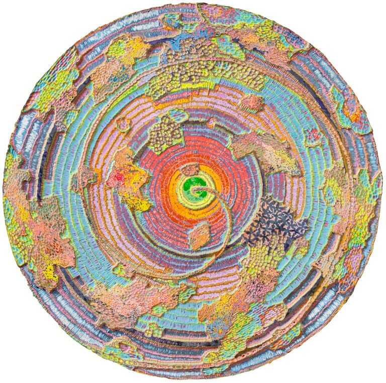 an abstract wood carving with bright acrylic paint in multiple colors